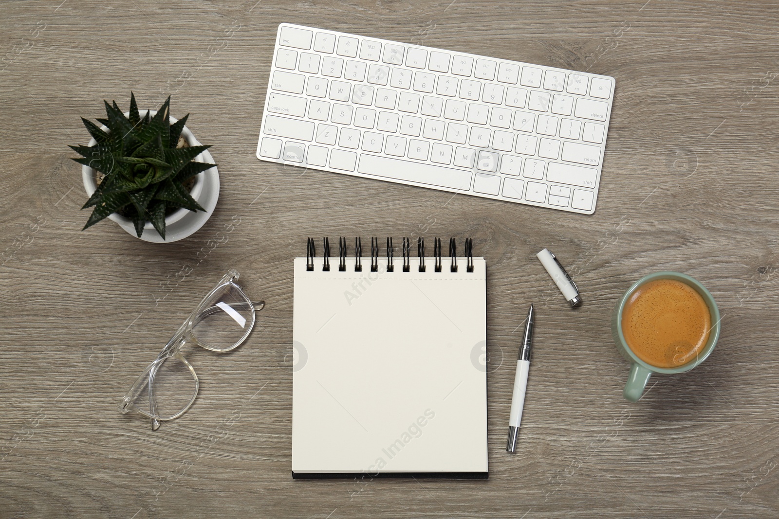 Photo of Flat lay composition with notebook on wooden table