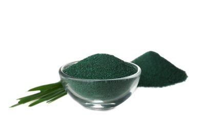 Photo of Composition with spirulina algae powder and grass isolated on white