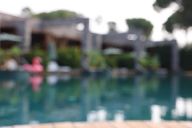 Blurred view of outdoor swimming pool at luxury resort