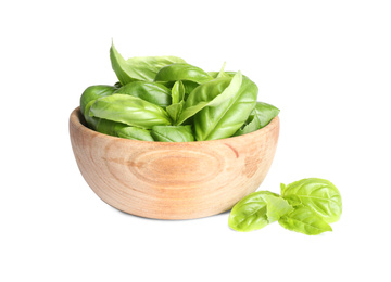 Fresh green basil leaves in wooden bowl isolated on white