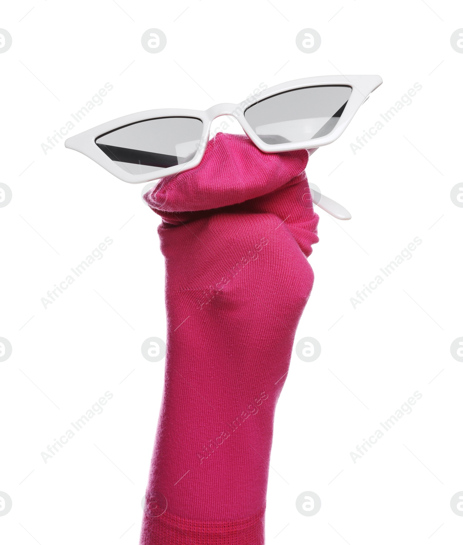 Photo of Funny sock puppet with sunglasses isolated on white