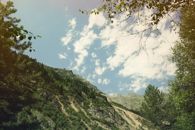 Picturesque view of mountains under cloudy sky outdoors