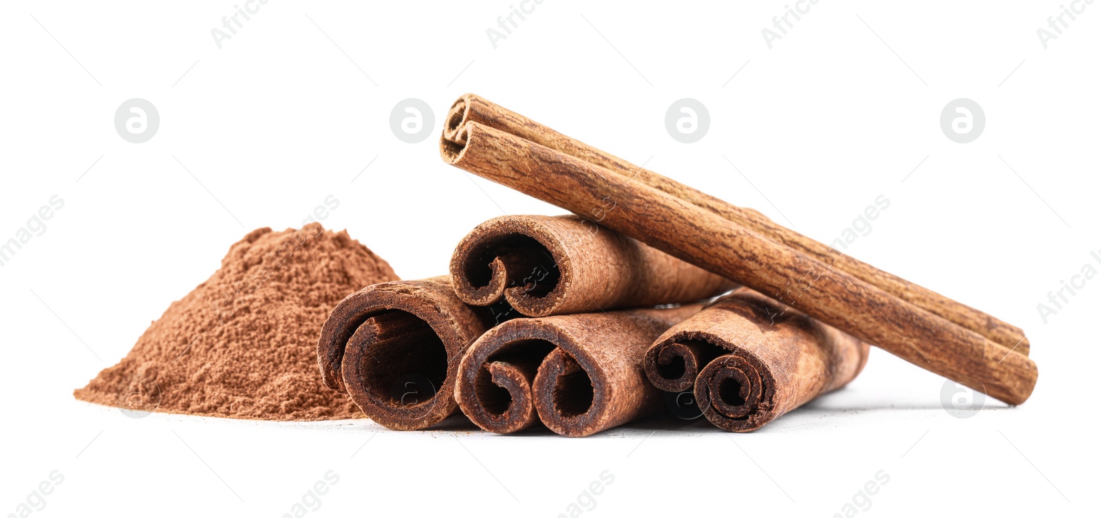 Photo of Dry aromatic cinnamon sticks and powder isolated on white