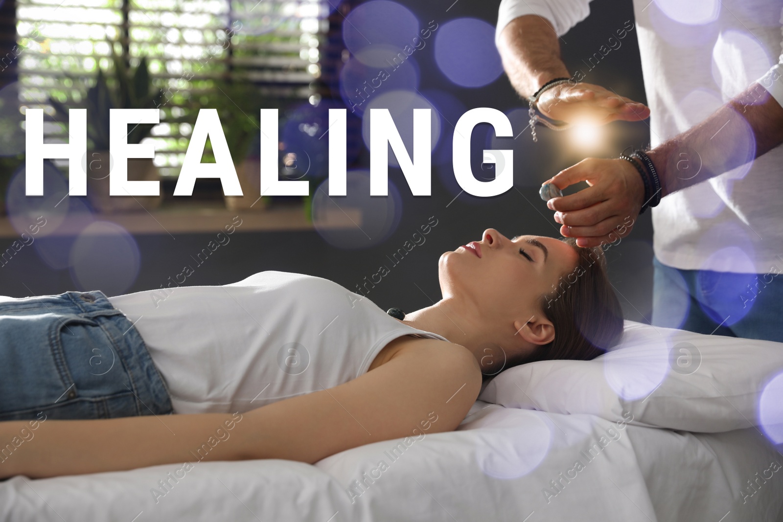 Image of Young woman during crystal healing session in therapy room