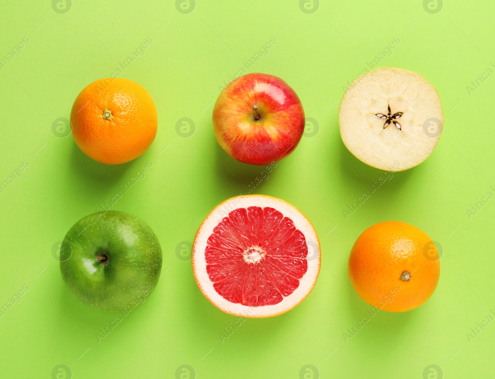 Photo of Flat lay composition with fresh fruits on color background