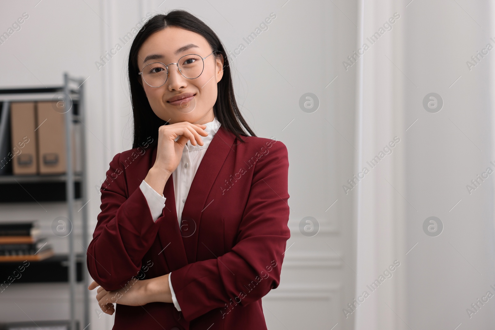 Photo of Portrait of happy notary in office. Space for text