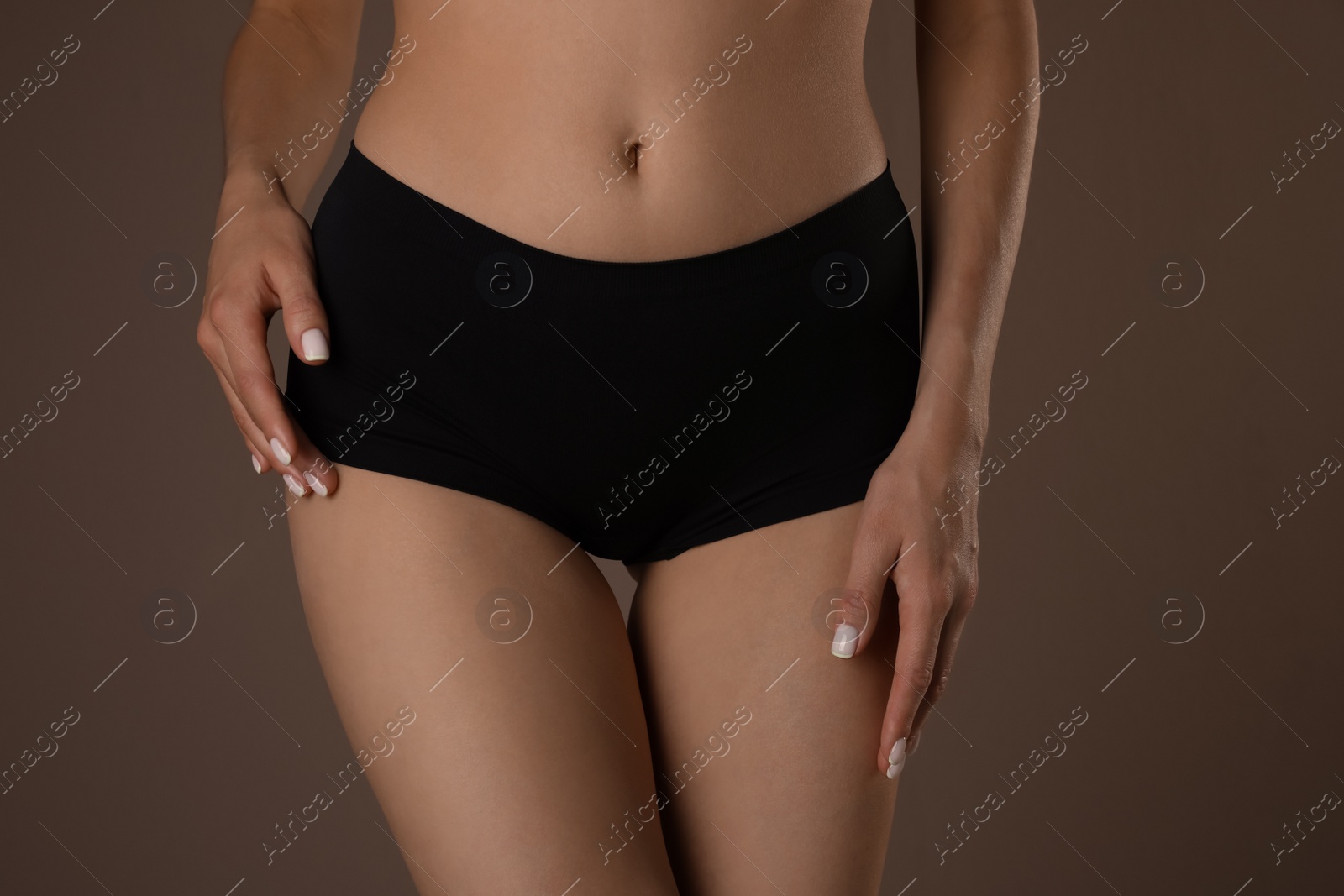 Photo of Slim woman with smooth skin in underwear on beige background, closeup. Cellulite problem concept