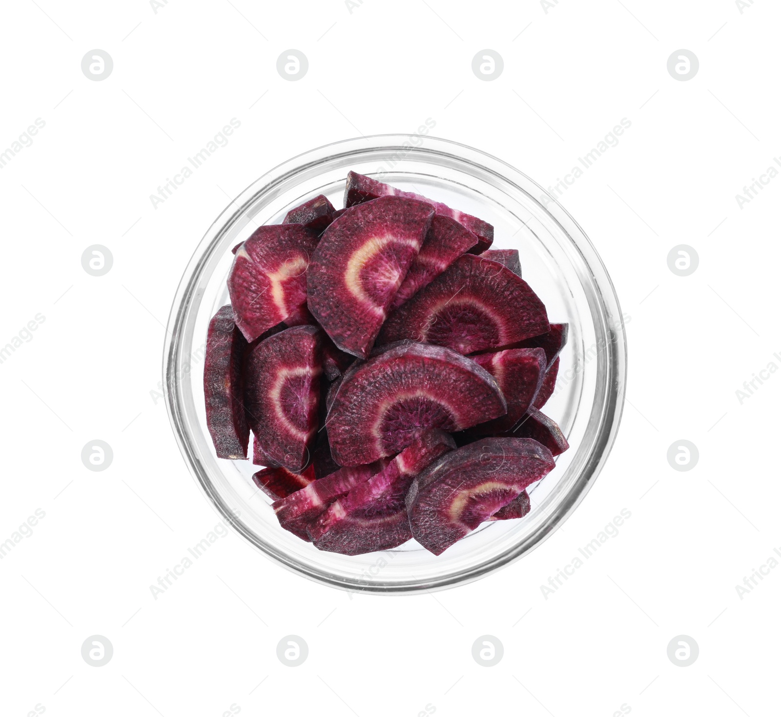 Photo of Slices of raw purple carrot in glass bowl isolated on white, top view