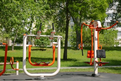 Photo of Empty outdoor gym with exercise machines in park