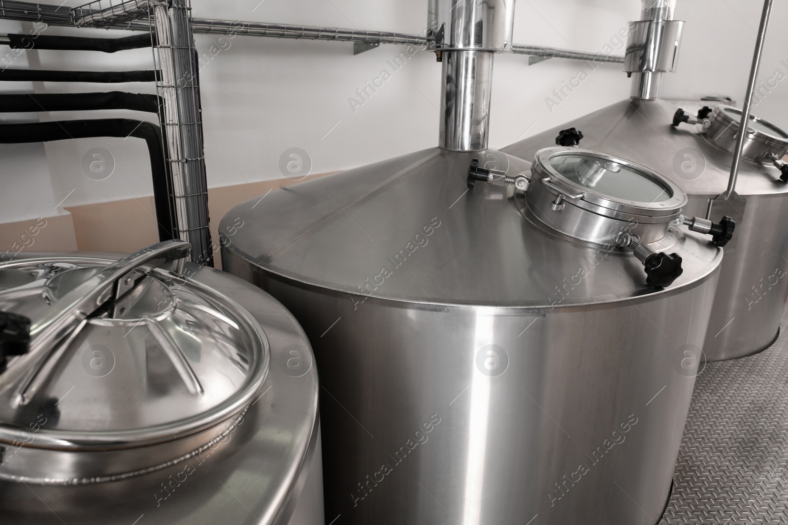 Photo of Steel tanks for beer fermentation in brewhouse