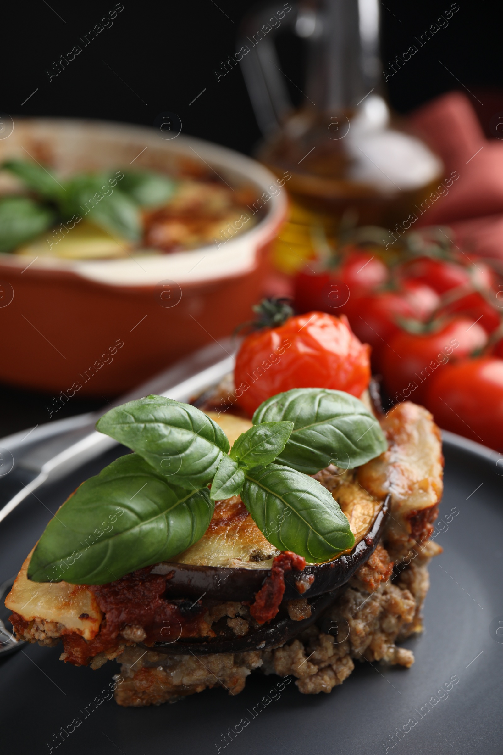 Photo of Plate of delicious eggplant lasagna on table, closeup