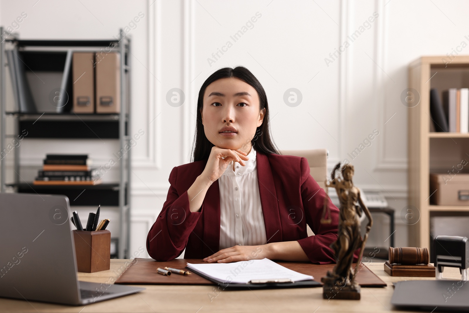 Photo of Portrait of notary at table in office