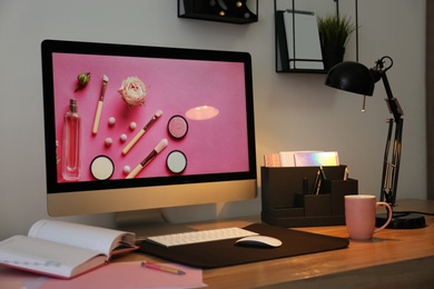 Photo of Modern workplace interior with computer on table