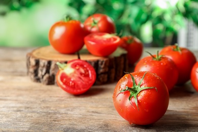 Fresh ripe red tomatoes on wooden table