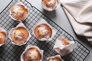 Photo of Delicious muffins on grey table, flat lay