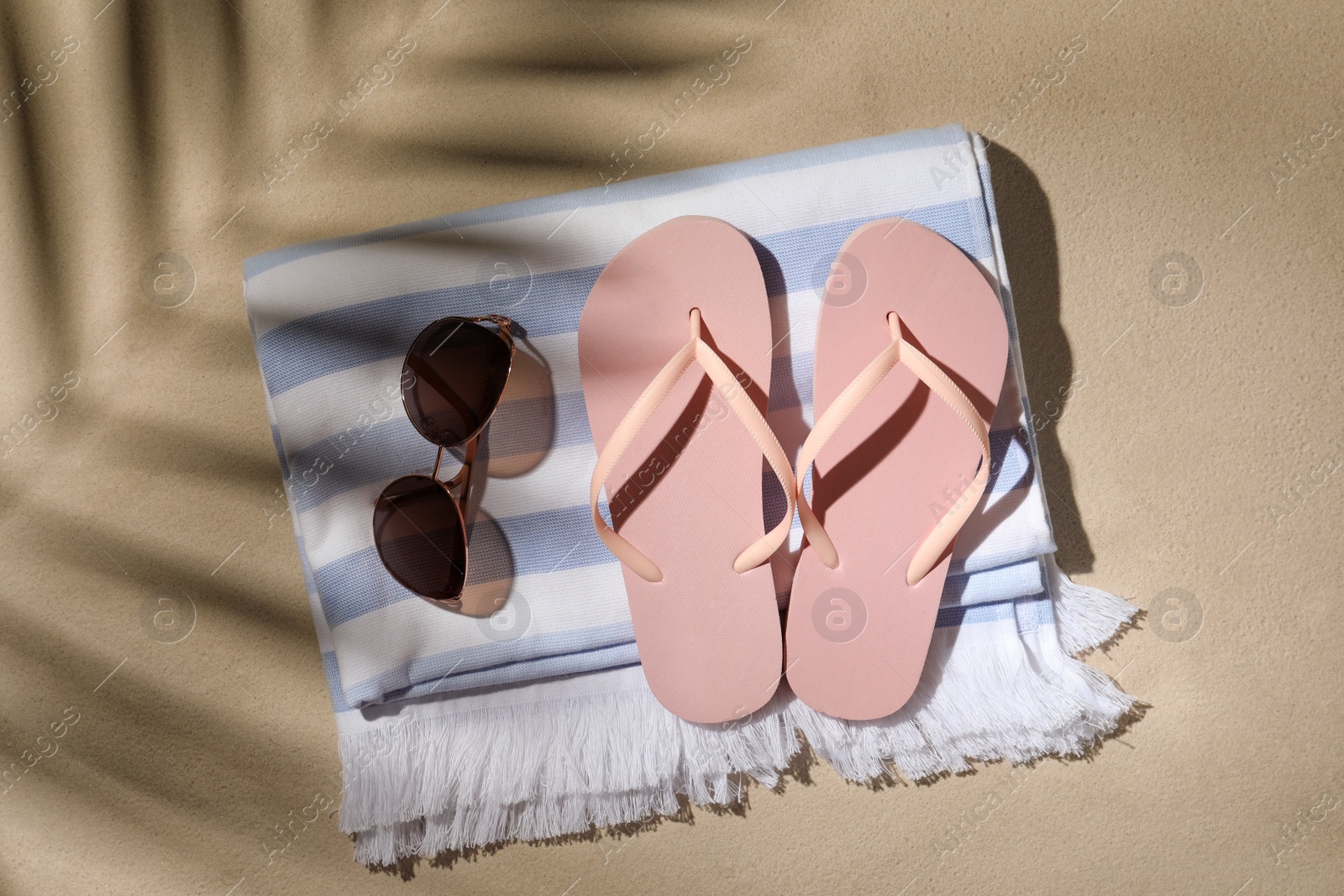 Photo of Flat lay composition with beach objects on sand