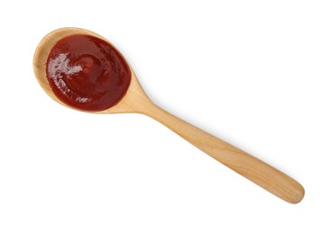 Photo of Tasty barbecue sauce and spoon isolated on white, top view