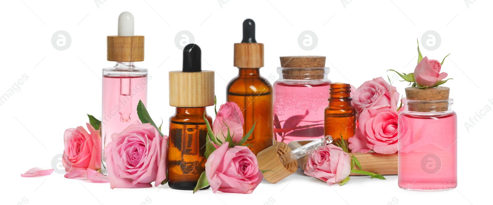 Image of Set with bottles of essential rose oil and flowers on white background. Banner design