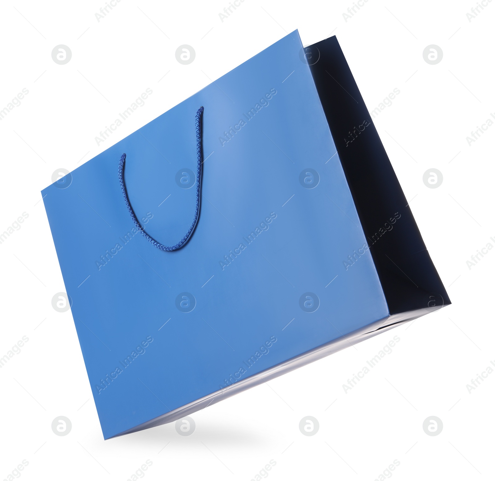 Photo of One blue shopping bag isolated on white