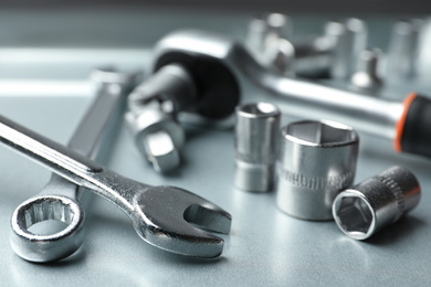 Photo of Auto mechanic's tools on metallic surface, closeup