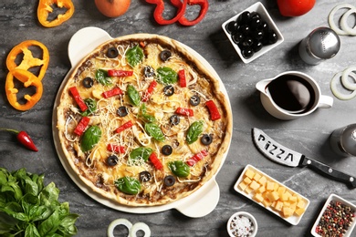 Photo of Flat lay composition with delicious homemade pizza and ingredients on marble background
