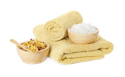 Photo of Spa composition. Towels, dry flowers and sea salt on white background