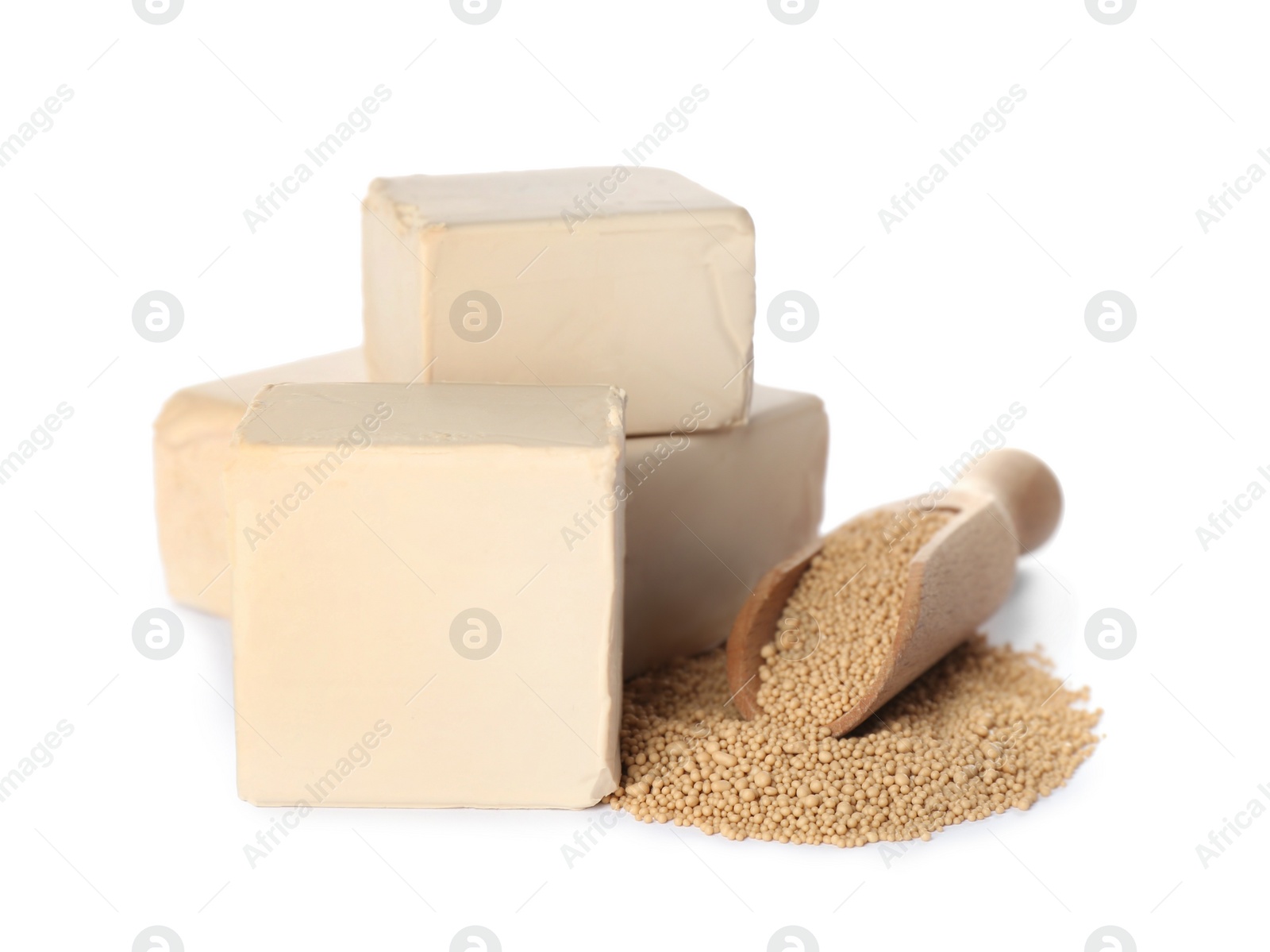 Photo of Compressed and granulated yeast on white background