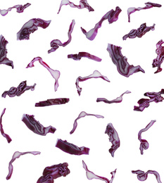 Set with falling fresh pieces of red cabbage on white background