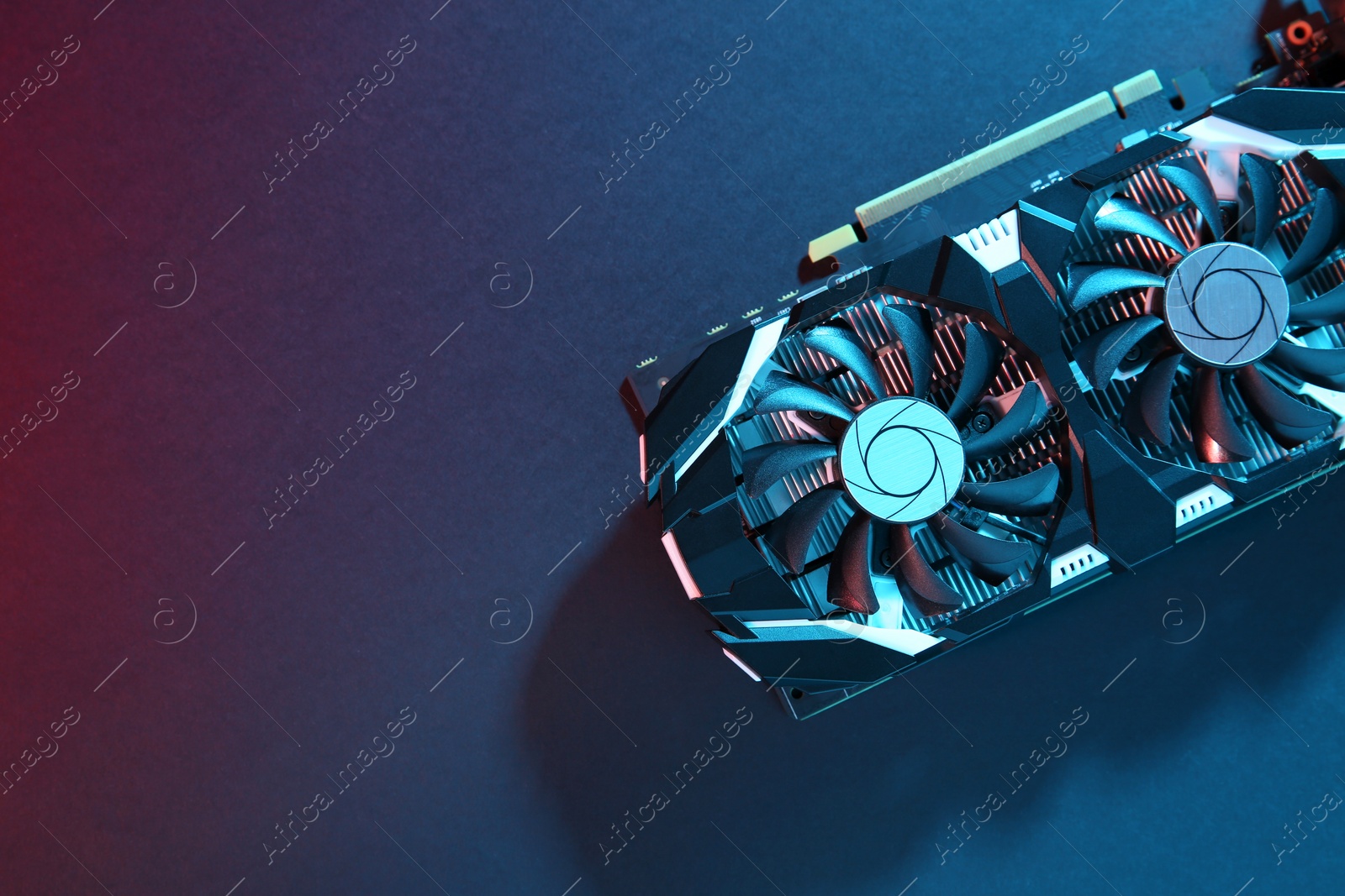 Photo of Computer graphics card on color background, top view. Space for text