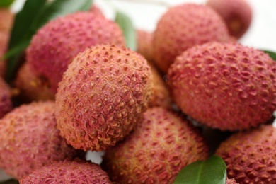 Photo of Pile of fresh ripe lychee fruits, closeup