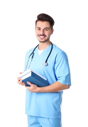 Young medical student with books on white background