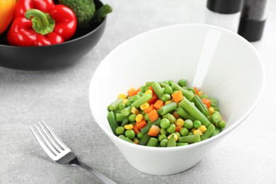 Photo of Mix of fresh vegetables served on grey table