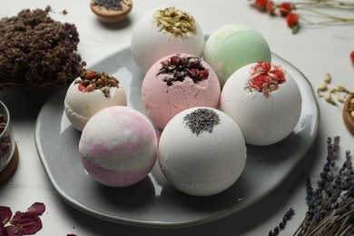 Photo of Different bath bombs and ingredients on light table