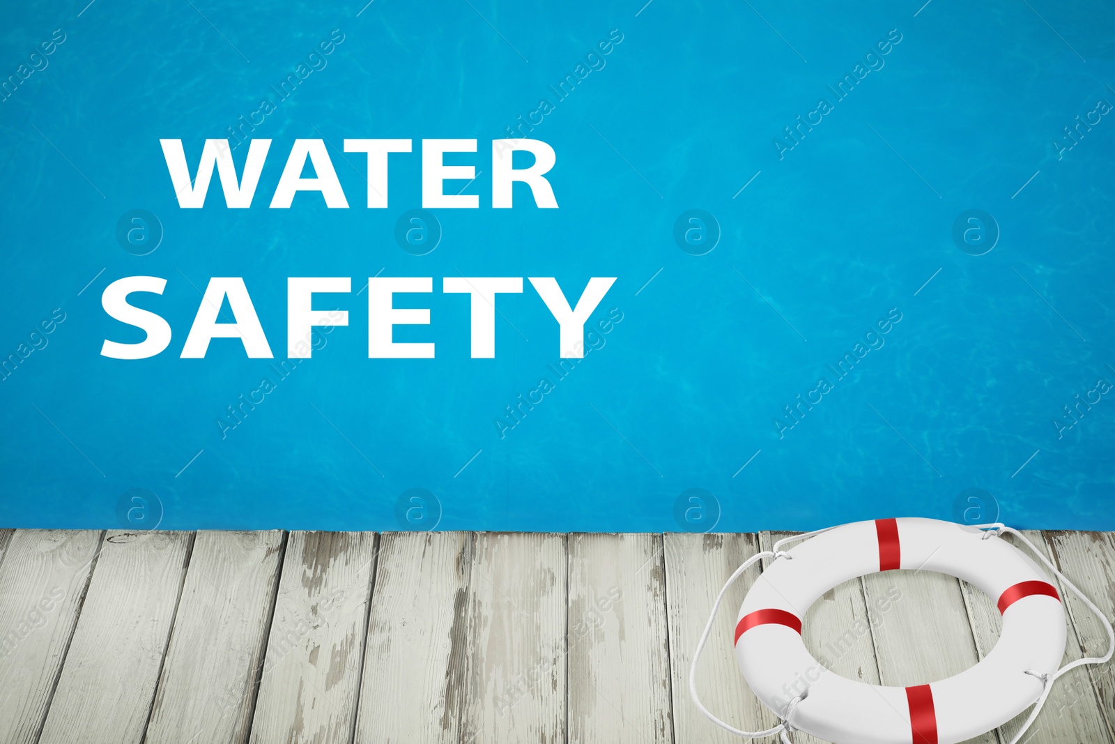 Image of Water safety. Life buoy near swimming pool with clean blue water 