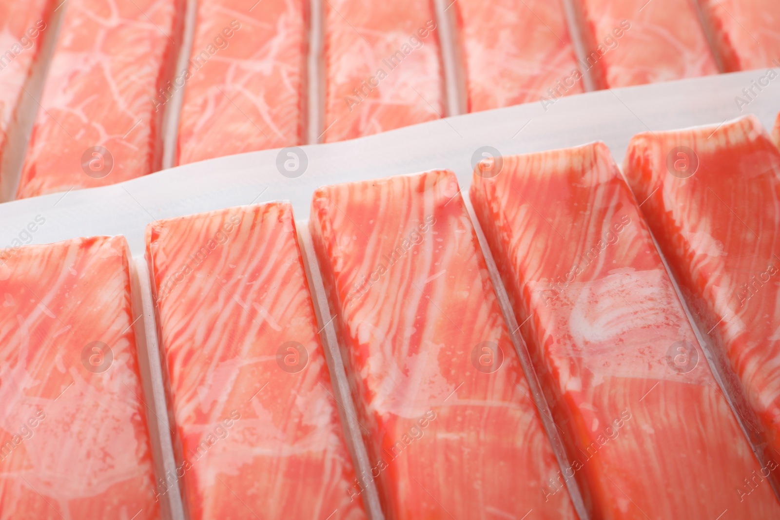 Photo of Closeup view on packs of fresh crab sticks