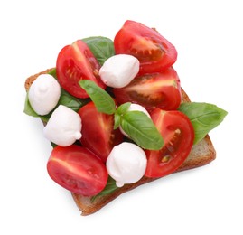 Delicious Caprese sandwich with mozzarella, tomatoes, basil and pesto sauce isolated on white, top view