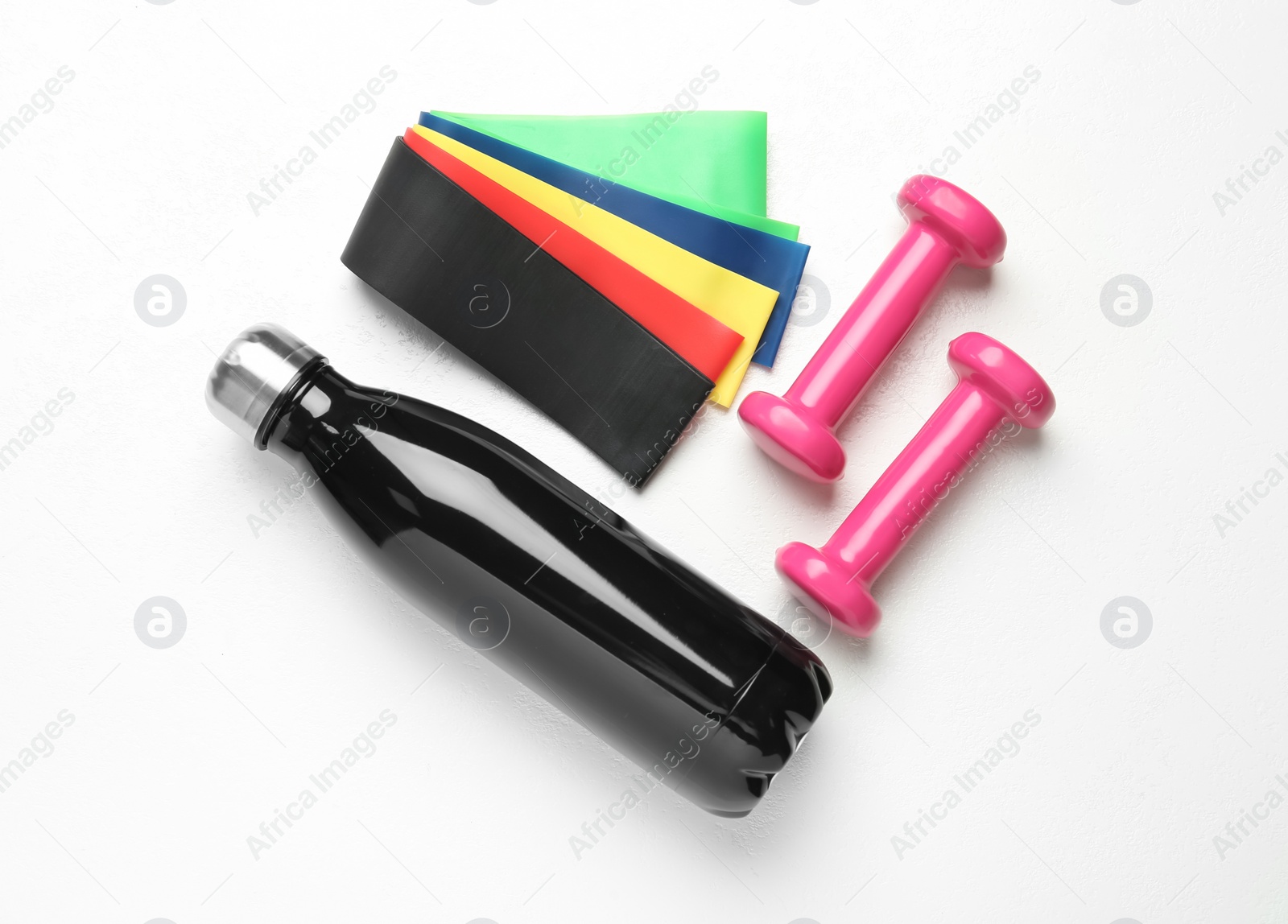 Photo of Flat lay composition with fitness elastic bands on white background