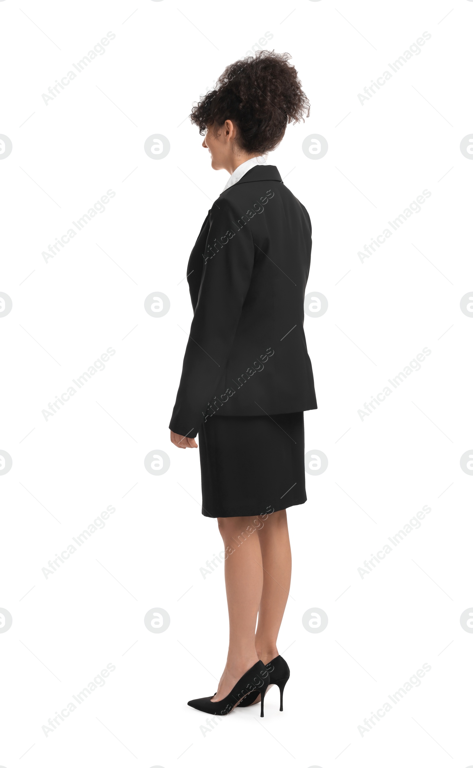 Photo of Young businesswoman in suit standing on white background