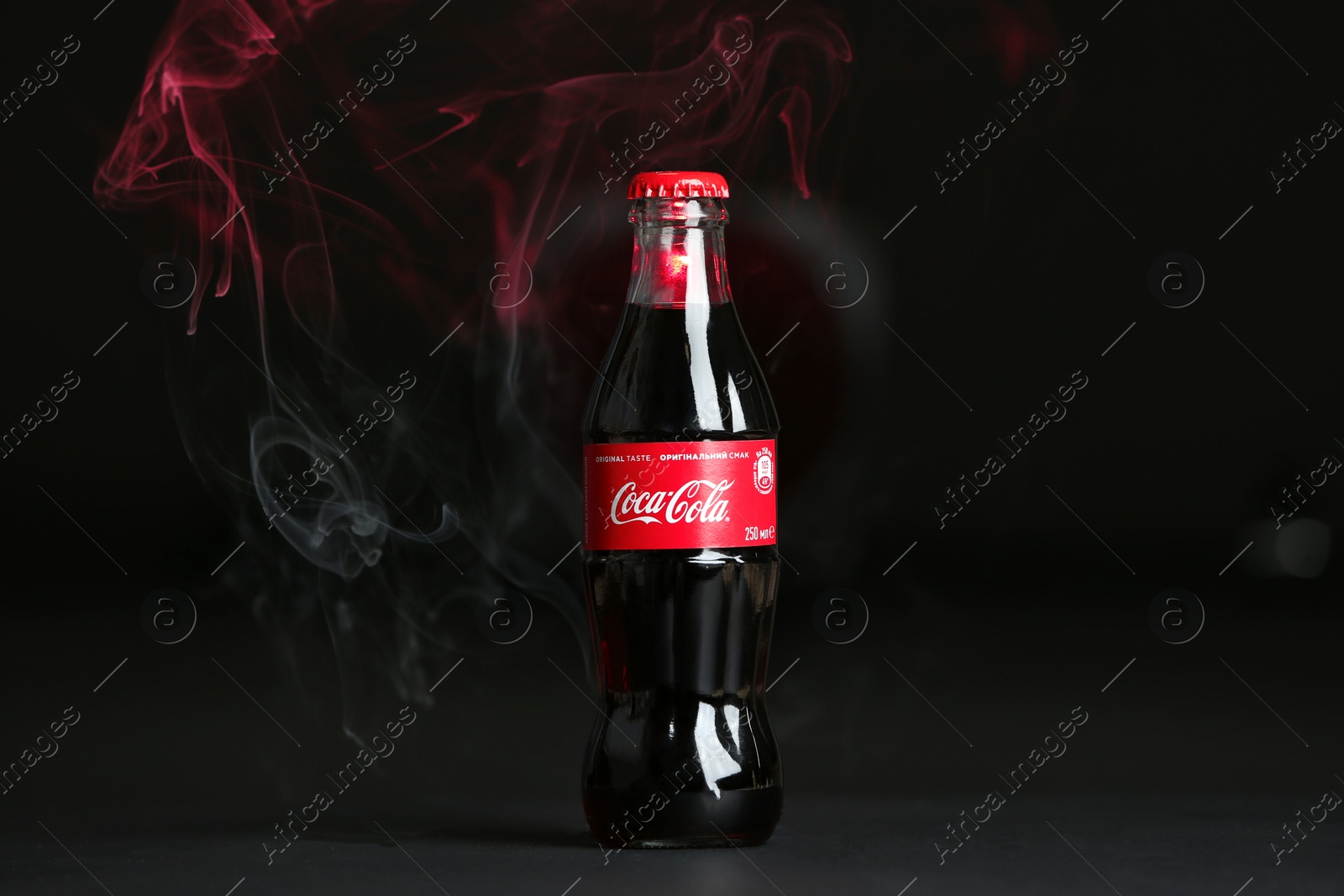 Photo of MYKOLAIV, UKRAINE - NOVEMBER 14, 2018: Bottle of Coca-Cola on dark background