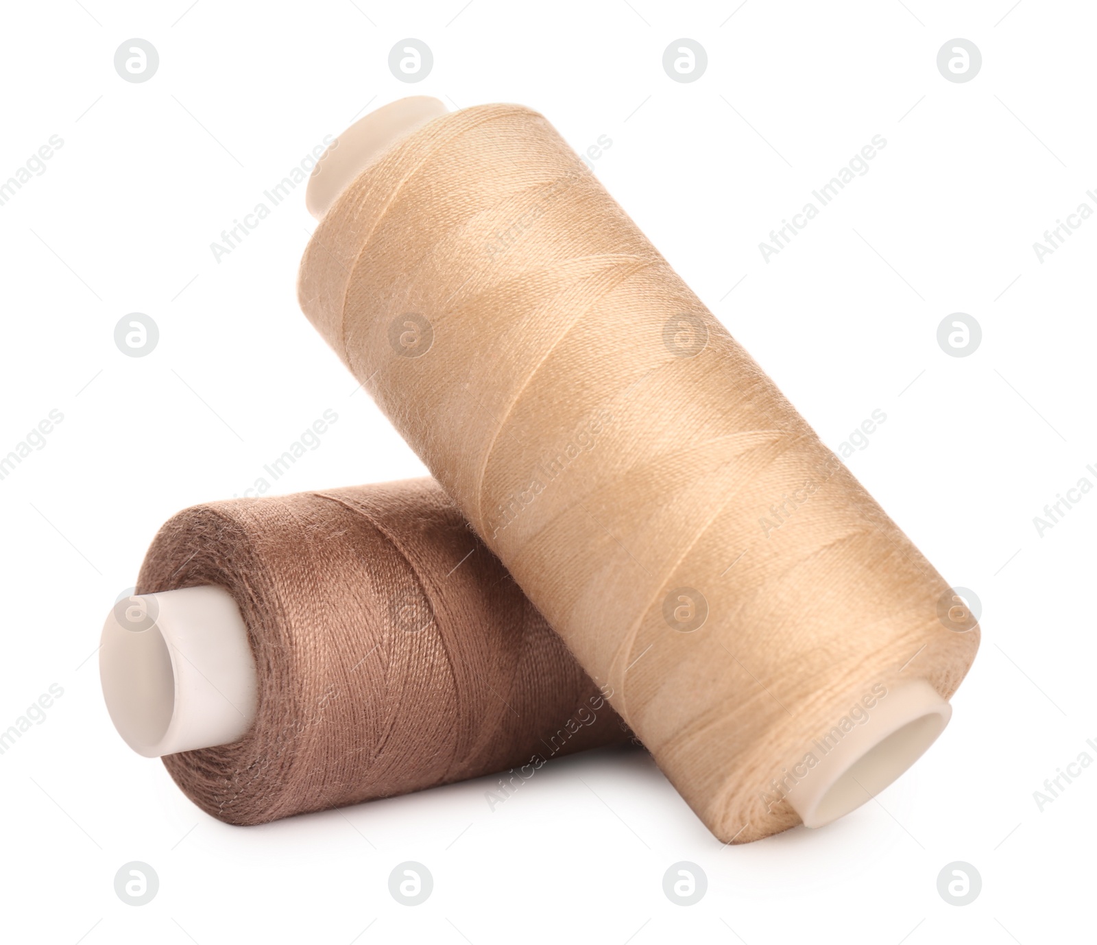 Photo of Different colorful sewing threads on white background