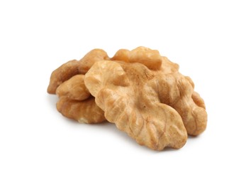 Photo of Halves of ripe walnut isolated on white