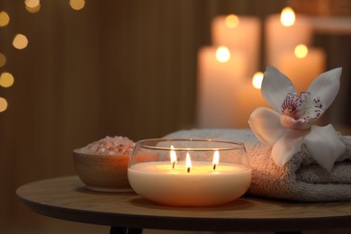 Photo of Composition with different spa products and orchid flower on wooden table