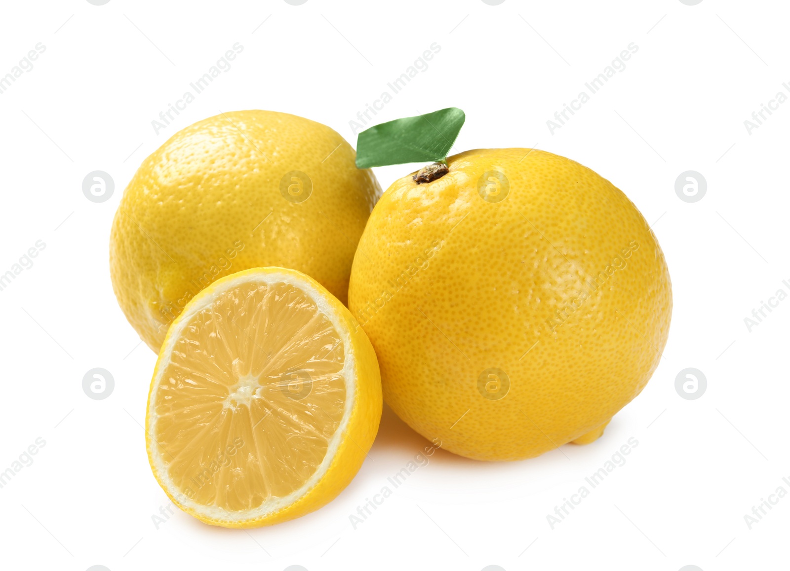 Photo of Ripe whole and sliced lemons on white background