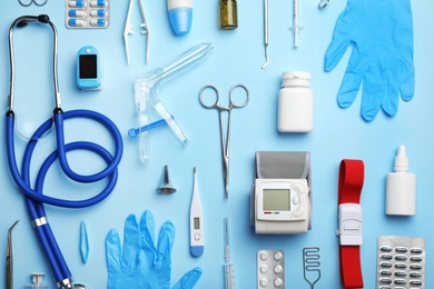 Photo of Flat lay composition with medical objects on color background