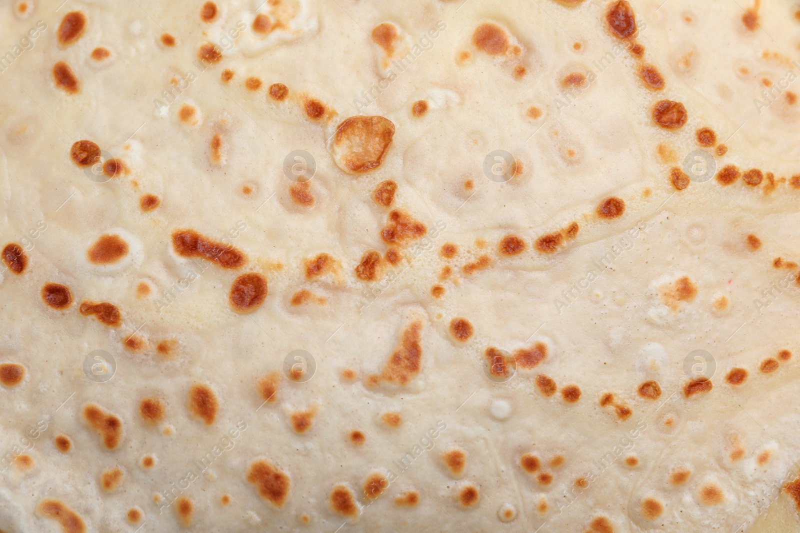 Photo of Closeup view of delicious crepe as background