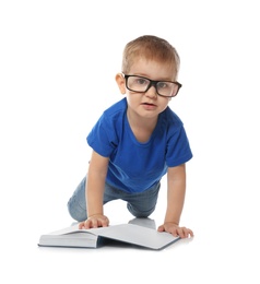 Photo of Little child with eyeglasses and book on white background