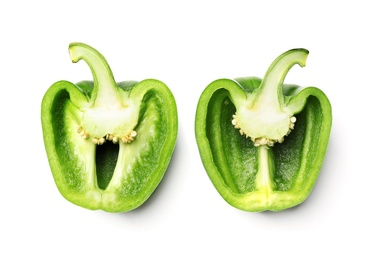 Halves of green bell pepper on white background, top view