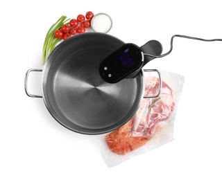 Thermal immersion circulator in pot and ingredients on white background, top view. Sous vide cooking