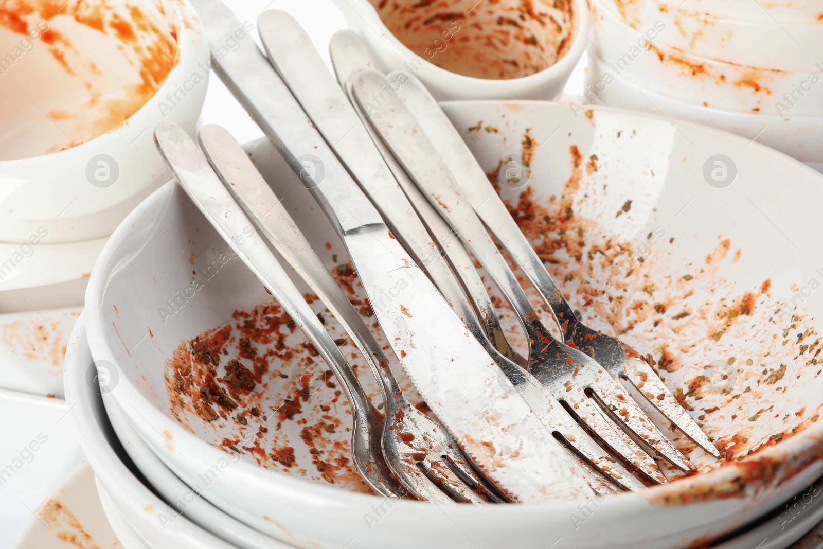 Photo of Pile of dirty dishes and cutlery, closeup