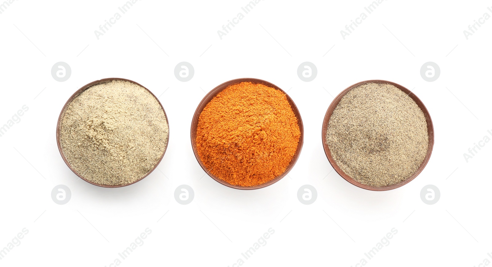 Photo of Bowls with different kinds of milled pepper on white background, top view